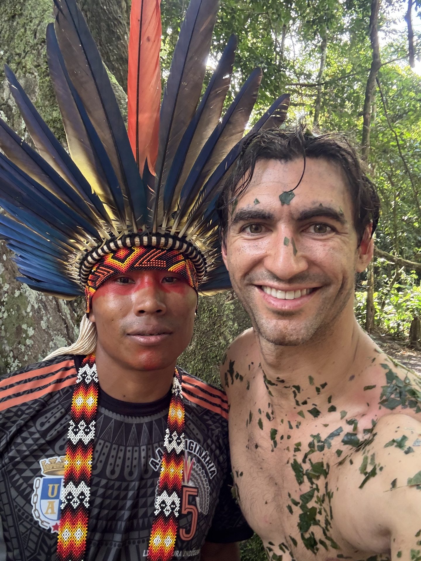 Anthony with an indigenous guide during ceremony in the Amazon